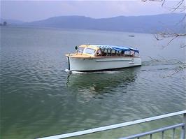 A passenger boat sounds its horn on Lake Ägeri at Morgarten